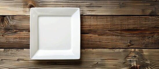 Aufkleber - Square plate on wooden backdrop with copy space image for your design.