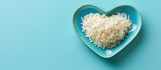 Poster - Heart-shaped plate with raw rice on a blue backdrop, providing room for text or images.