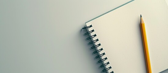 Aufkleber - Desk with notepad, notebook, and pencil, displayed against a plain background with space for text or graphics (copy space image).
