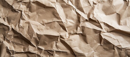 Aufkleber - Crumpled craft paper with a beige tone creating a textured and recycled look against a brown background, providing a rustic aesthetic with a copy space image.