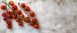 © HN Works - Rustic white background with tomatoes on the vine creating an appealing copy space image.