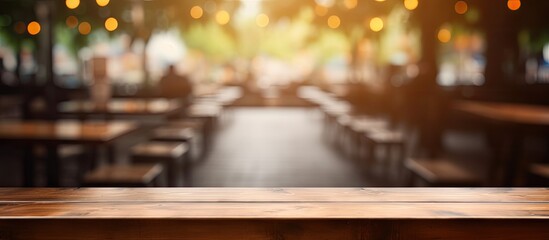 Poster - Brown wooden table with empty space setting, blurred Coffee shop background, ideal for product display with bokeh effect in the image.