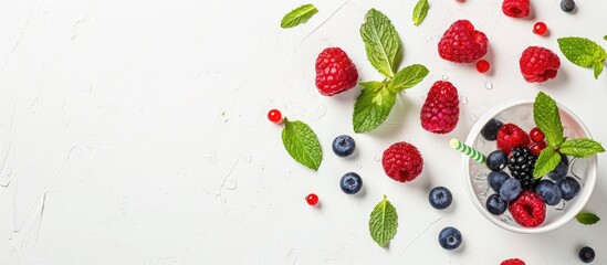 Aufkleber - A refreshing summer drink with mint, berries, and a straw, placed on a white background with room for text around the cocktail for a copy space image.