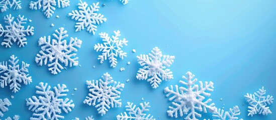 Poster - A festive Christmas background featuring white snowflakes on blue, with a top view perspective and room for a copy space image, conveying holiday greetings for Merry Christmas and a Happy New Year.