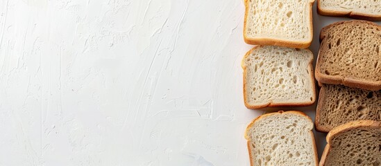 Canvas Print - White and gray bread slices displayed on a white surface with copy space image.