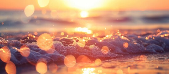 Poster - Abstract bokeh background of a sunset beach with waves and sunlight reflecting on the water, creating a serene summer scene with copy space image.