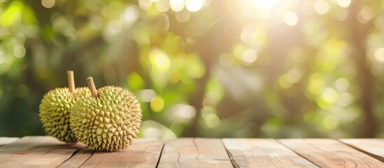 Fototapete - Wooden table with a ripe durian set against a blurry backdrop creates a perfect copy space image