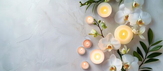 Leinwandbilder - Create a soothing spa ambiance for a massage with candles orchids and a white backdrop in this top down view frame with copy space image