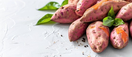 Leinwandbilder - Sweet potatoes on a white background providing plenty of copy space for images