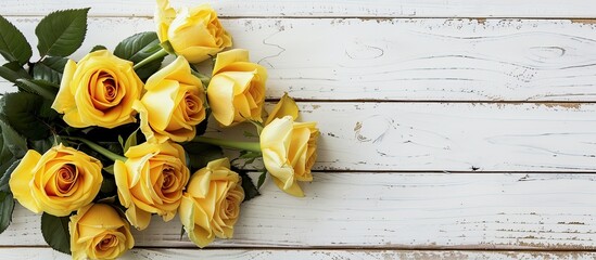 Leinwandbilder - Yellow roses displayed against a white wooden backdrop with copy space image available