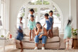 © Alexis S/peopleimages.com - Stress, tired and portrait of single mother with kids playing on couch with exhausted mom or composite. Headache, frustrated and overwhelmed parent with adhd children jumping on sofa in family home