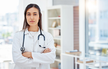 Poster - Portrait, woman and doctor with arms crossed, healthcare and career ambition in hospital. Serious face, person or medical with professional, stethoscope or attitude with confidence or pride in clinic