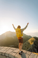 Wall Mural - Young woman- tourist on the top of famous place. Negosh Mausoleum. Travel, nature, trip concept.