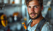 © Vadim - Construction Worker Portrait. A young man with a beard, wearing a work uniform, stares intently at the camera.
