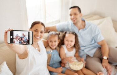 Poster - People, family and happy with selfie in sofa at home for fun, bonding and support for memories. Parents, mom and dad with kids in couch with popcorn for profile picture or social media with smile