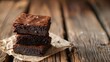 © Антон Сальников - Baking and dessert on wooden background, a stack of chocolate brownies