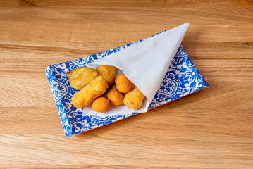 Wall Mural - These are delicious fried balls made with a mixture of bechamel and other ingredients such as ham, cod, chicken, spinach, among others