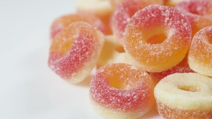 Poster - sweets peach ring gummy candies on the white background.