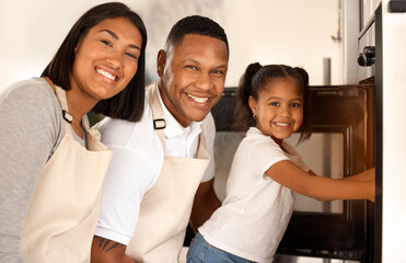 Canvas Print - Family, kid and portrait of parents baking at oven in kitchen for learning, help or teaching girl. Happy mother, father and face of child cooking at small business, startup or bakery at stove in home