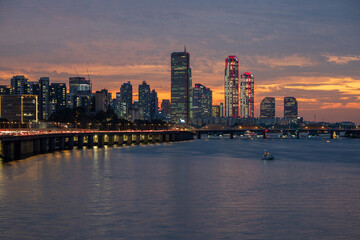 Wall Mural - Yeouido, Dongjak-gu, Seoul, South Korea - October 7, 2023: Night view of Han River Bridge on Han River against 63 building and Park One Tower of financial district
