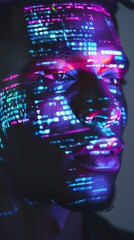 Software developer is illuminated by lines of code projected onto his face, representing the intersection of humanity and technology
