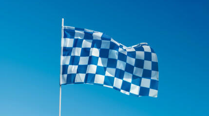 Bavarian blue and white checkered flag waving in the wind with clear blue sky background 