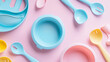 © Mahmud - A top view of children's tableware including a silicone bib and a bowl, ideal for serving baby food and other kid-friendly dishes.