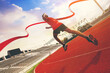 © Panumas - Fit young man running sprinting to red finish line at the racetrack. Finisher, marathon runner sprinting moment at the racetrack.
