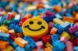© grey - A smiley face emoji constructed from small colorful bricks.
