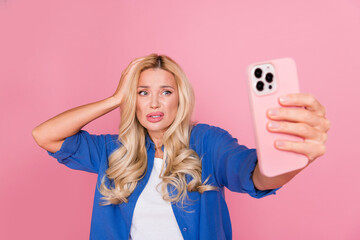 Poster - Photo of doubtful attractive lady dressed blue jacket taking selfie modern device empty space isolated pink color background