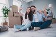 © deagreez - Full size photo of two young partners embrace make selfie phone relocating moving box package new modern flat indoors
