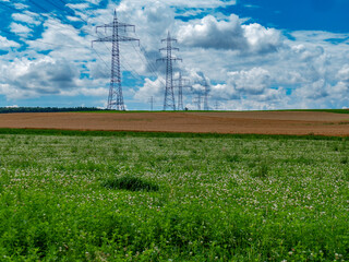 Poster - Hochspannungsmasten im Feld