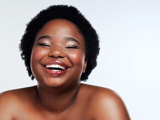 Wall Mural - Portrait, funny and black woman with cosmetics, dermatology and luxury on white studio background. African person, face or model with beauty, makeup and wellness with shine, self care or skincare