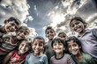 © Rudsaphon - Group of joyful children smiling and looking up at the camera under a beautiful cloudy sky.