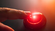 © VK Studio - A finger presses a glowing red button, surrounded by a warm light, emphasizing the decisive nature of the action being taken.