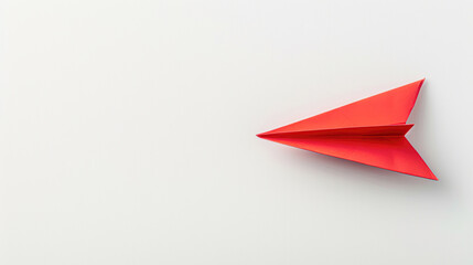 Poster - A red paper airplane is on a white background