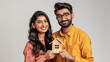 © Sutha - Happy Indian couple buying a house, Concept photo. Real estate.