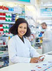 Wall Mural - Healthcare, pharmacy and portrait of woman at counter with smile, advice and package in drug store. Happy, pill box and confident pharmacist with wellness, prescription medicine and health insurance