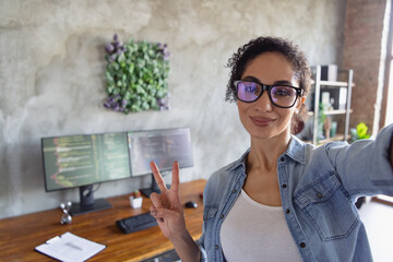 Wall Mural - Photo of young girl professional hacker take selfie show v-sign loft interior modern office indoors