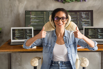 Photo of adorable lovely confident girl wear trendy denim shirt thumb up programming modern technology workspace indoors