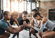 © peopleimages.com - People, exercise and squat in group at gym for workout, core fitness or training together indoors. Diverse class, friends and warm up for muscle, session or sport for health challenge in gymnasium