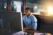 © peopleimages.com - Office, computer and business black man with glasses for website, research and reading news at night. Corporate, developer and worker online for software update, networking and working on web design
