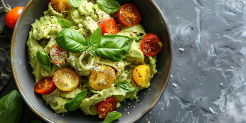 Wall Mural - Creamy avocado pasta with cherry tomatoes, basil, and nutritional yeast