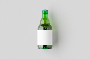 Wall Mural - Green steinie beer bottle mockup with blank label.