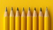 © Julia Jones - Aligned Yellow Pencils on Vibrant Yellow Background