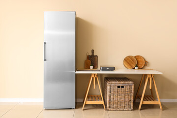 Canvas Print - Modern fridge and table with kitchen utensils