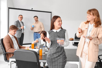 Wall Mural - Young business women having lunch in office