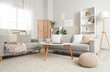 © Pixel-Shot - Comfortable sofas and pictures on wall in living room