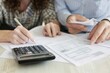 © SHI - Woman Senior Bill Finance retirement couple home file calculator Paper wife budget old man together mature old retirement paperwork tax