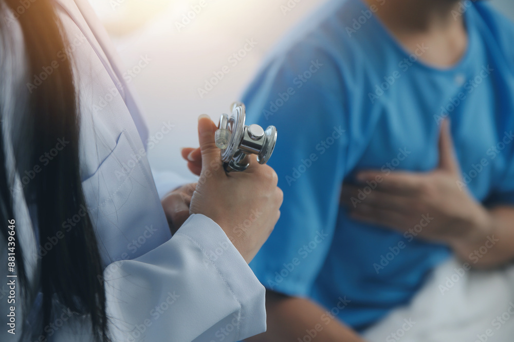 Young doctor is using a stethoscope listen to the heartbeat of the ...